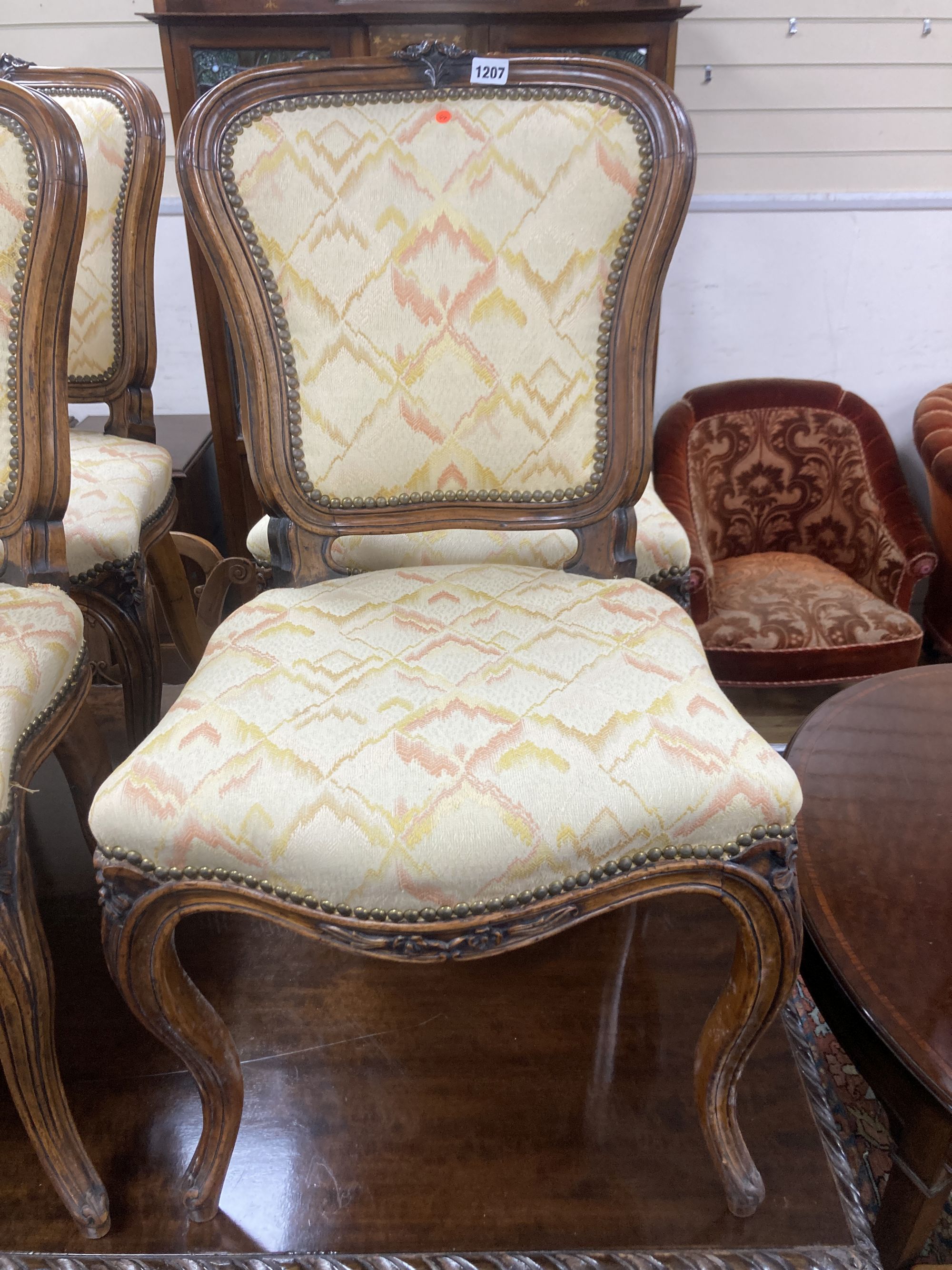 A set of six Louis XV style dining chairs, with cream and pink silk upholstery